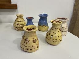 hand made coil pots painted yellow and blue